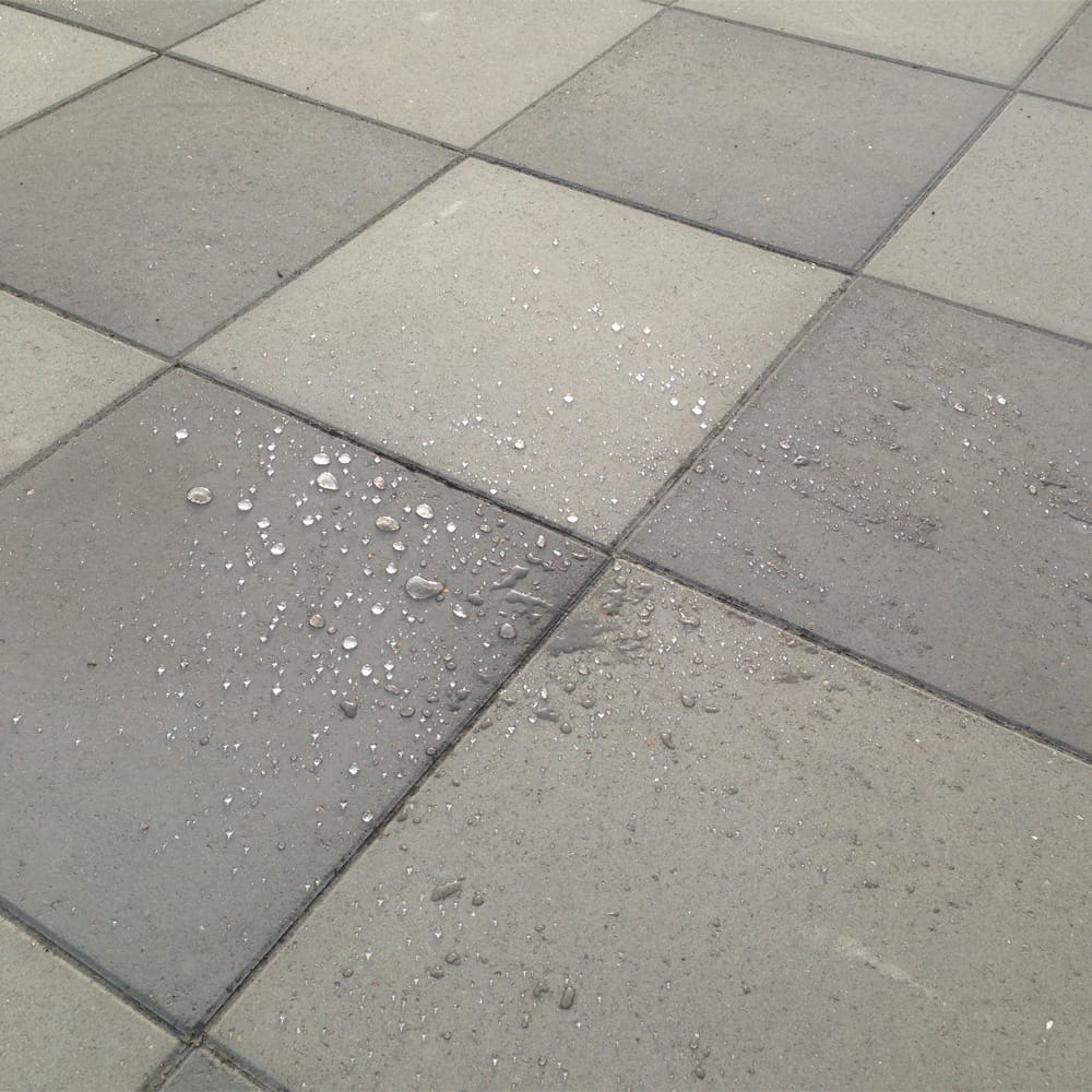 Nanotechnology coating being applied to a building surface